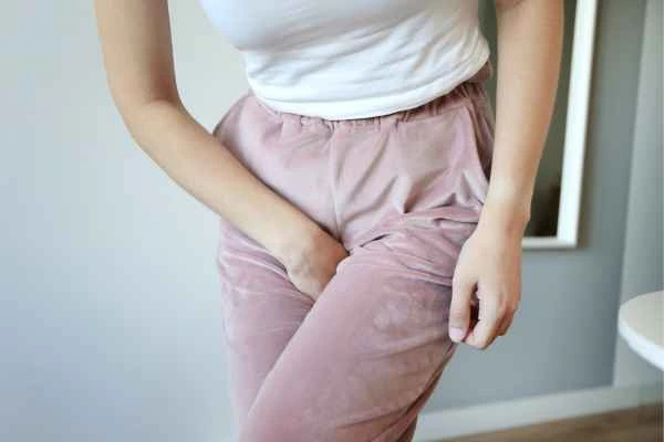 woman running for the toilet because of urinary incontinence Knightsbridge